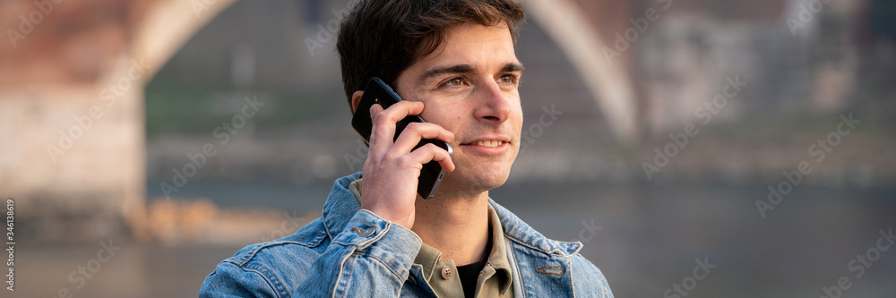 fashion man who uses smartphone by calling fashion man who uses smartphone by calling