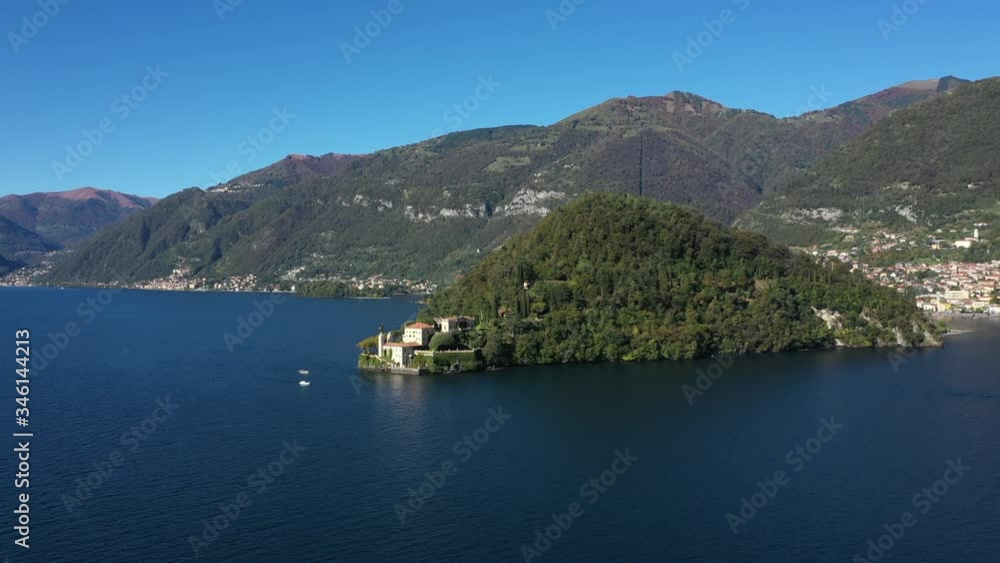 Panoramic top view of Lake Como. Lombardy, Italy. Villa del Balbianello, famous villa in the comune of Lenno. Autumn season. Perfect clear blue sky. Panoramic top view of Lake Como. Lombardy, Italy. Villa del Balbianello, famous villa in the comune of Lenno. Autumn season. Perfect clear blue sky.