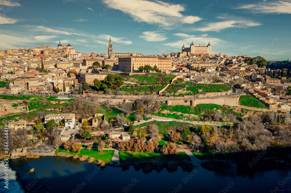 Panoramic view of Toledo, Spain with the Tagus river in the foreground and the Alcazar in the background. Winter.