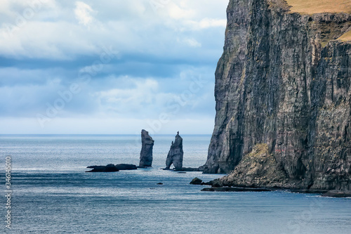 Close up photo of sea stacks (Risin and Kellingin) before storm, Eysturoy, Faroe Islands, Denmark. Europe photo