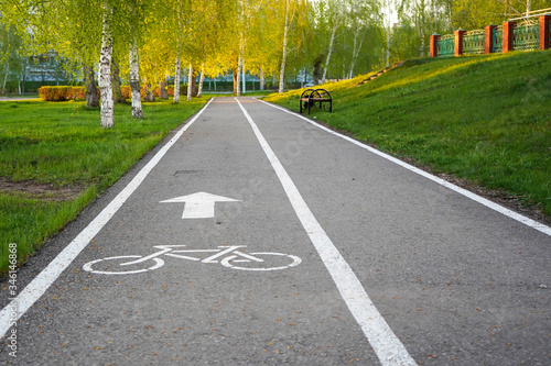 Bike path in a city Park, bike path sign on asphalt