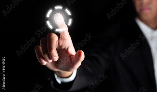 businessman touch on graphic for icon with fingerprint to unlock the key in office to scan for access and authorization connect online social business and network in office with technology concept