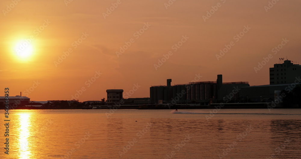 The golden sun is falling on the Chao Phraya River, Thailand.