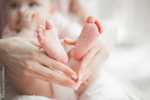 Close up still of baby s feet. Little toes in mother s hands. Baby concept. Maternity care.