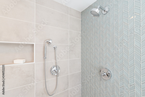 Fresh luxury shower with green glass tile wall