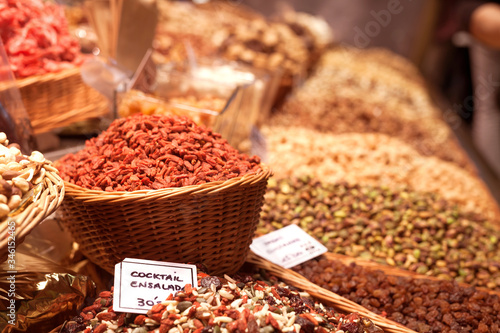 nuts and dried fruits on the counter in the market