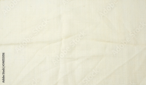 crumpled beige synthetic fabric for the manufacture of lining for skirts