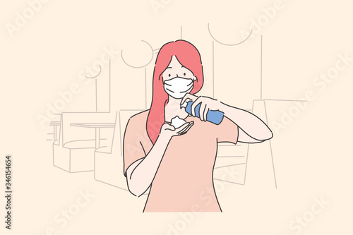 Healthcare, quarantine, protection, coronavirus infection concept. Young woman girl with medical face mask pouring antiseptic on hands. Preventive measures from Covid19 desease and 2019ncov biohazard.