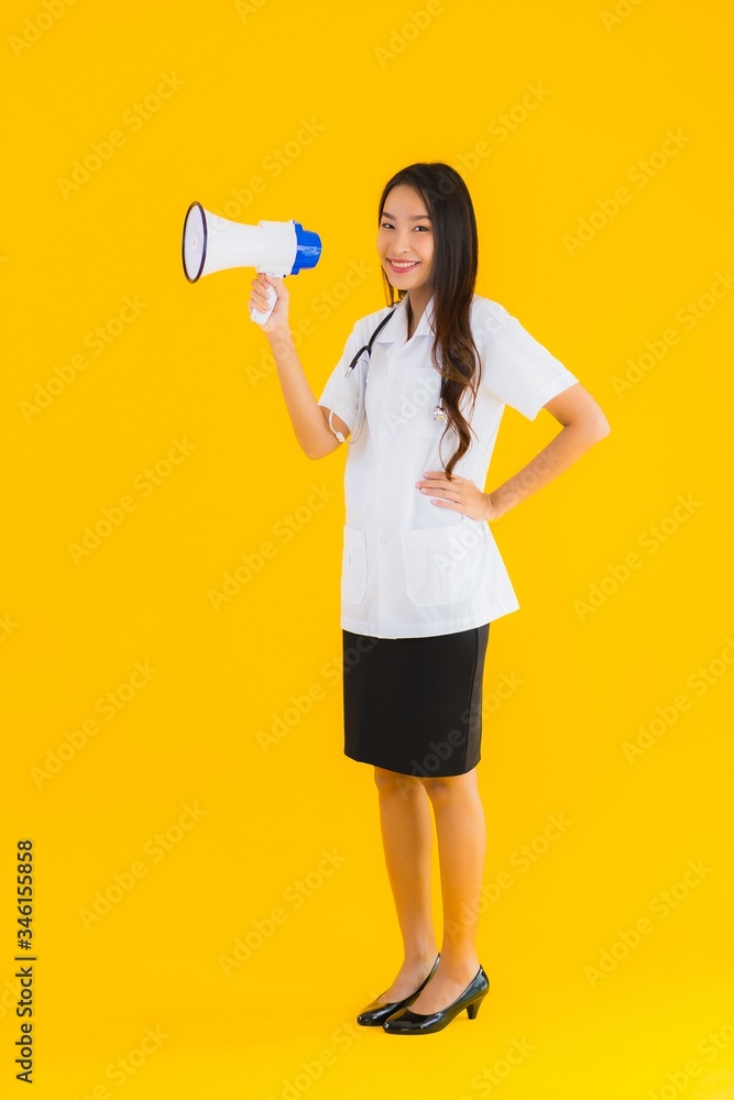 Portrait beautiful young asian doctor woman use megaphone Portrait beautiful young asian doctor woman use megaphone