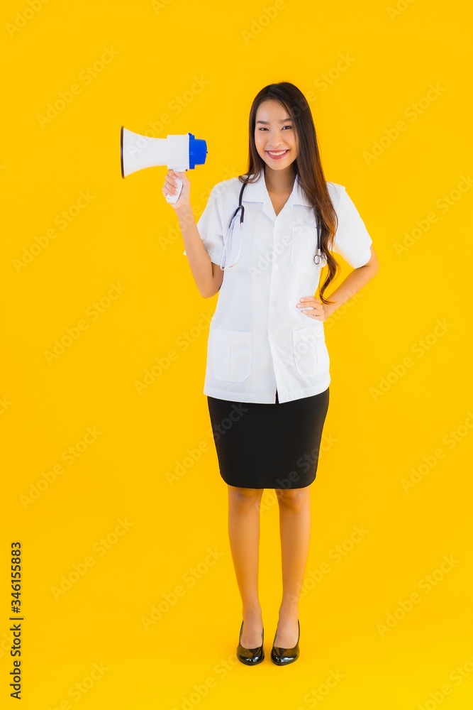 Portrait beautiful young asian doctor woman use megaphone Portrait beautiful young asian doctor woman use megaphone