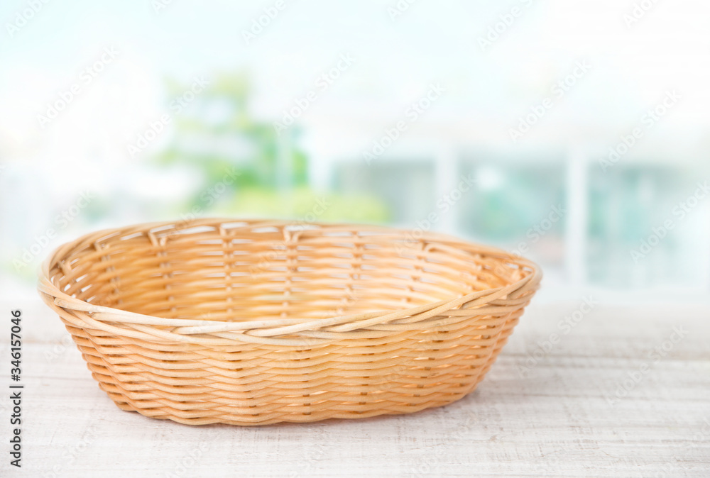 Wicker basket on a white wooden table