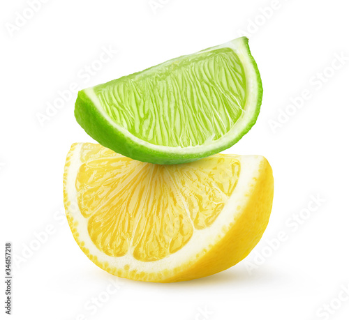 Isolated citrus fruit slices. Pieces of lime and lemon on top of each other isolated on white background © ChaoticDesignStudio