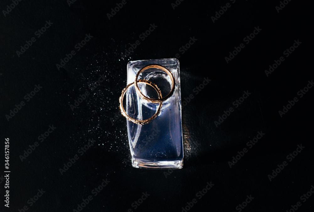 wedding rings on the black background wedding rings on the black background