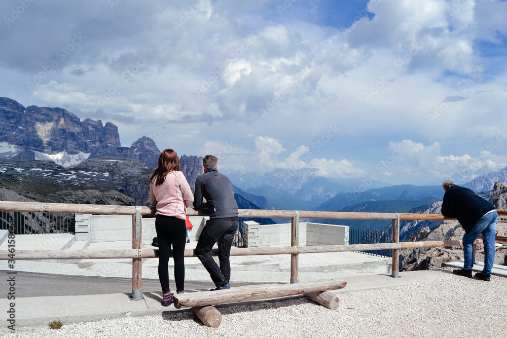 couple looking for amazing view. travel in Alps. Dolomites