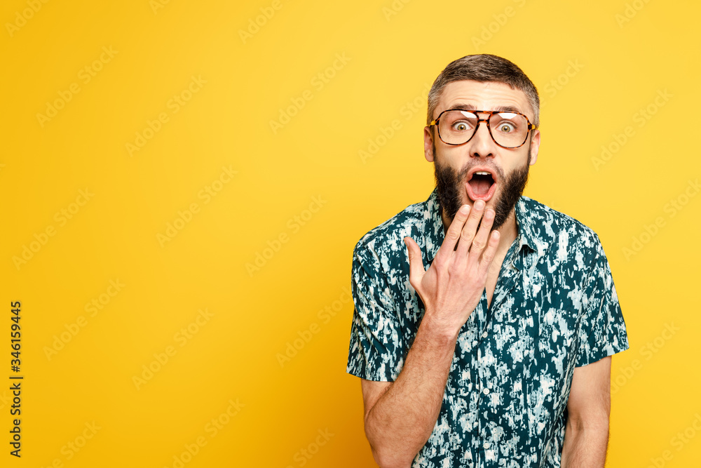 shocked bearded guy in glasses with open mouth on yellow shocked bearded guy in glasses with open mouth on yellow