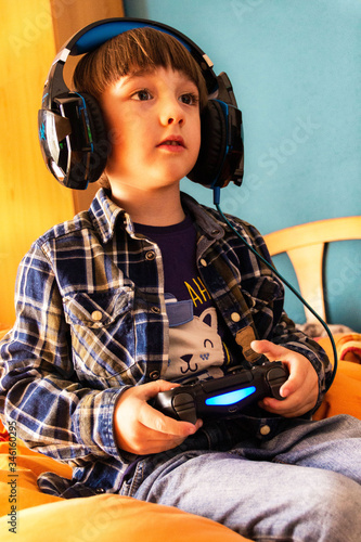 Boy gamer, playing with video games