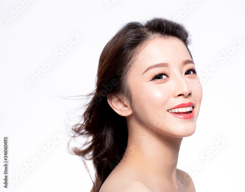 closeup young Woman face with hair motion on white background