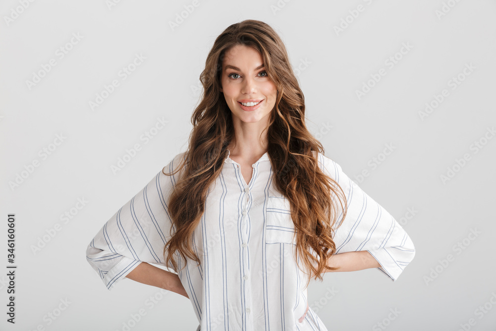 Image of smiling caucasian woman posing with hands on her waist Image of smiling caucasian woman posing with hands on her waist