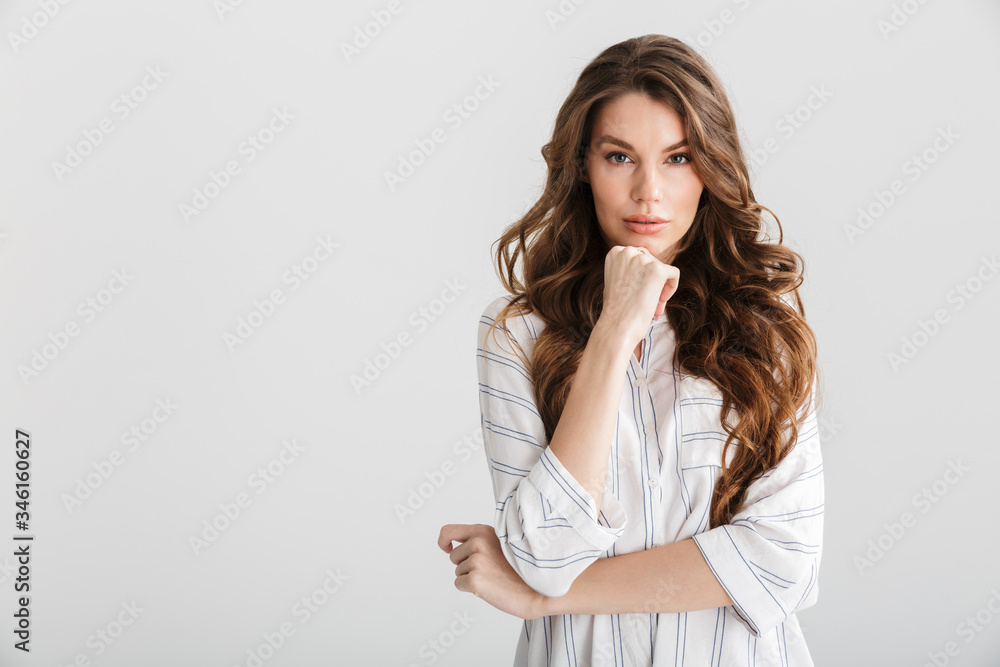 Image of thinking caucasian woman posing and looking at camera