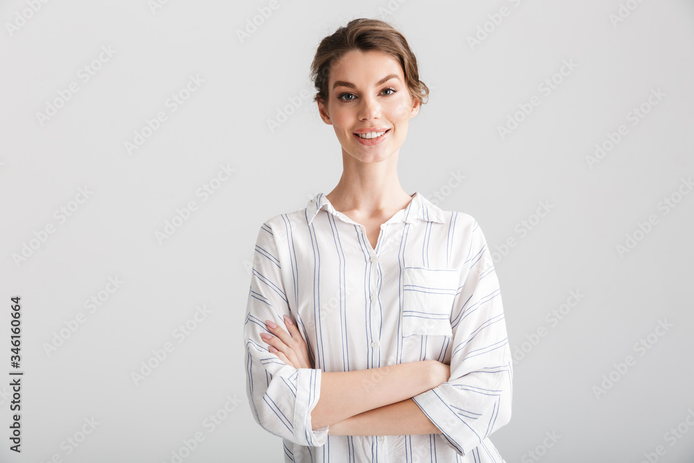 Image of cheerful caucasian woman smiling and looking at camera Image of cheerful caucasian woman smiling and looking at camera