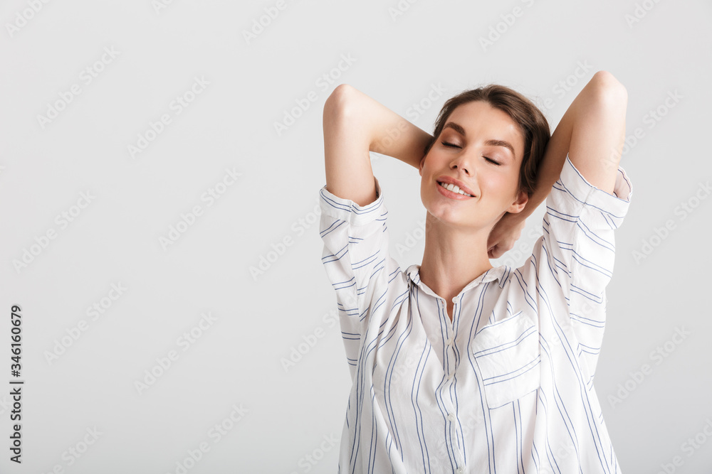 Image of relaxed caucasian woman smiling with eyes closed on camera Image of relaxed caucasian woman smiling with eyes closed on camera