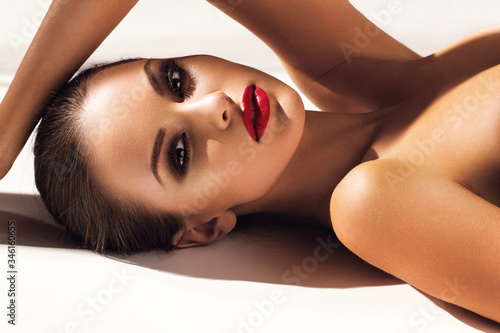 Beautiful young model with red lips. Gorgeous Woman Face. Bright makeup.