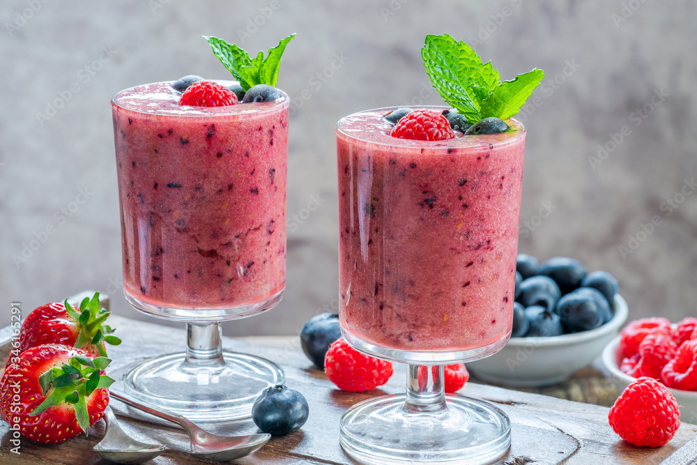 Mixed berry smoothie garnished with fresh fruit and mint Mixed berry smoothie garnished with fresh fruit and mint
