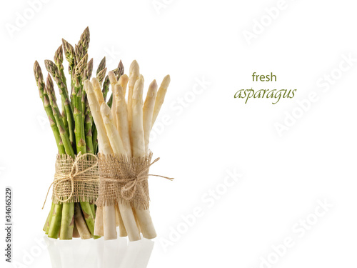 Fresh bundles of a green and white asparagus isolated on white background