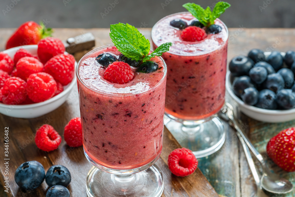 Mixed berry smoothie garnished with fresh fruit and mint Mixed berry smoothie garnished with fresh fruit and mint