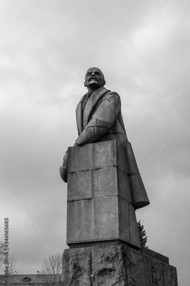 Fototapeta premium Black and white monument from granite to leader of world proletariat Lenin
