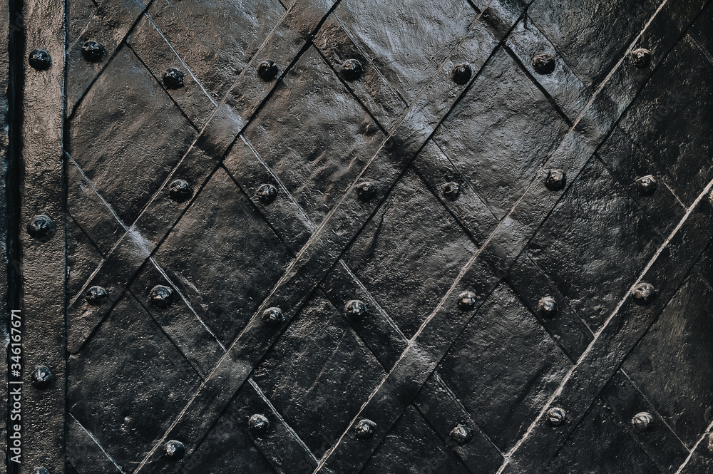 Old black metal door of Boim Chapel in Lviv. Vintage background close-up. Old black metal door of Boim Chapel in Lviv. Vintage background close-up.