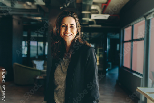 Smiling female executive in her office photo