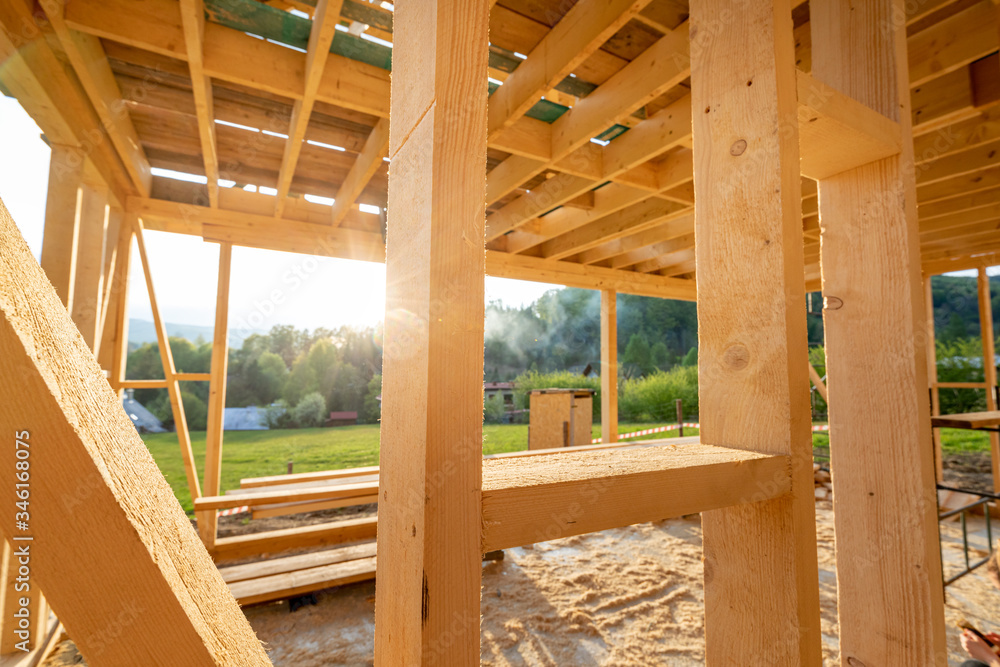 Interior frame of new wooden house under construction Interior frame of new wooden house under construction