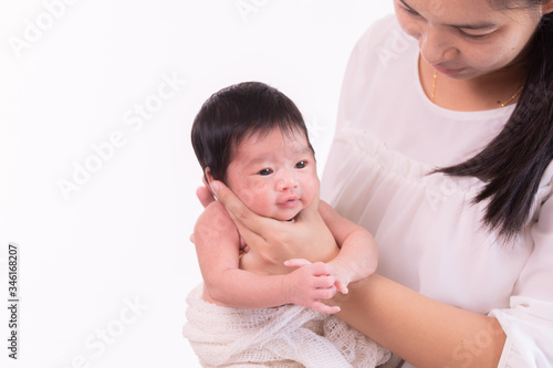 Beautiful young Asian mother hold tiny adorable newborn baby girl 0-1 month with her hand to help baby belch or Making burp after feeding with caring and love, lifestyle health care newborn at home