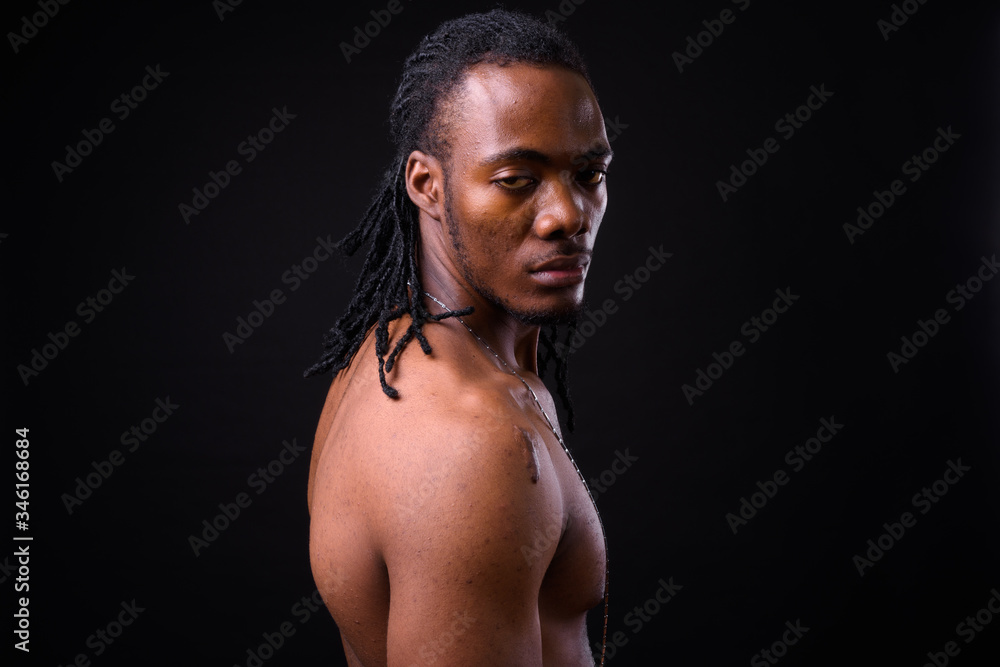 Face of young handsome muscular African man with dreadlocks shirtless Face of young handsome muscular African man with dreadlocks shirtless
