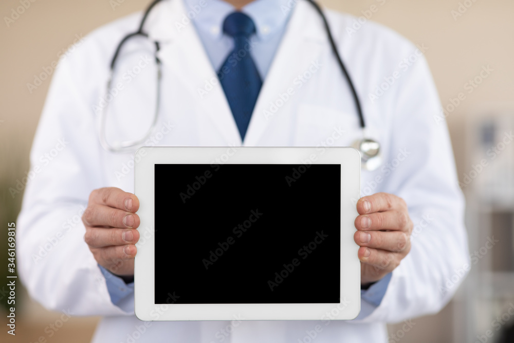 Doctor holding tablet with black blank screen Doctor holding tablet with black blank screen