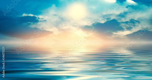 Background of a sea landscape. Blue sky with clouds over the sea. Sunlight  sunset