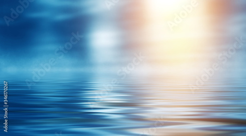 Background of a sea landscape. Blue sky with clouds over the sea. Sunlight, sunset