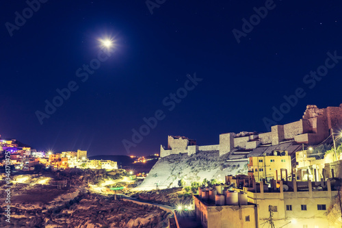 Kerak castle at night with lights stars and moon