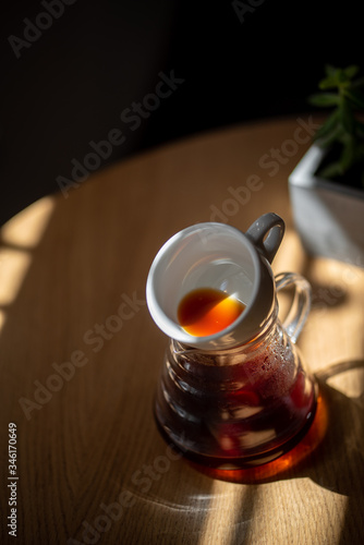 Black filter coffee on the table in cafe service kettle hario pour over cup