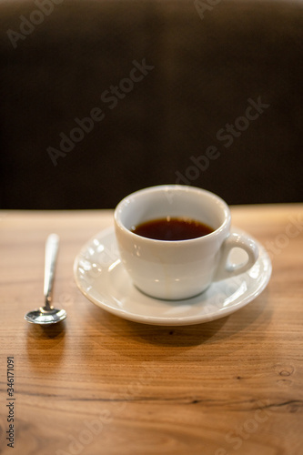 Black filter coffee on the table in cafe glass cup hario pour over cup side