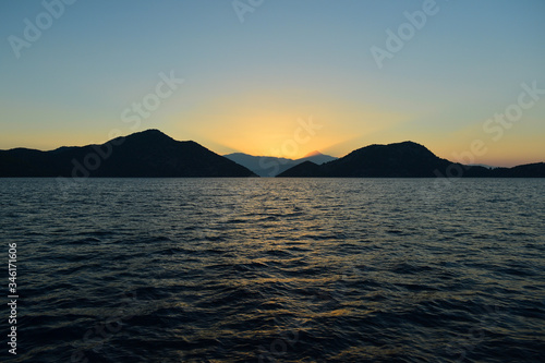 Sunrise in the Mediterranean Sea; ray of sun direct to sky