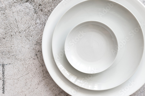 Wall Mural white color Plain dinner plate on stone table top view