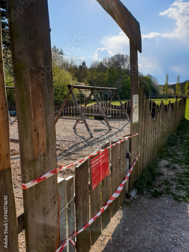 Playgroud in Vienna, Austria closed due to the coronavirus pandemic. A playground near Wien is taped off with caution tape. It's closed due to the statewide Stay at Home order caused by the COVID19. photo