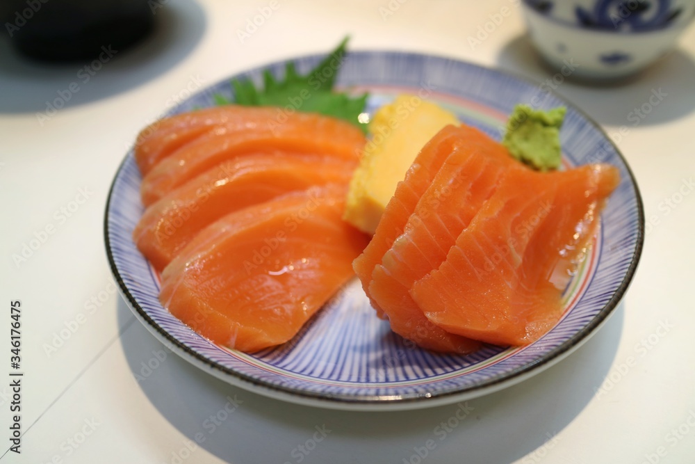 Salmon sashimi with wasabi, famous japanese food. Soft focus.