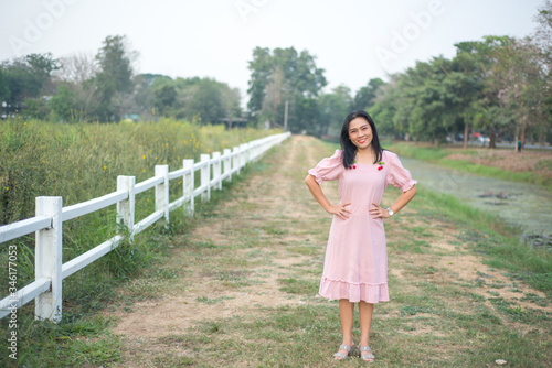 Asian woman take picture on field show travel nature concept