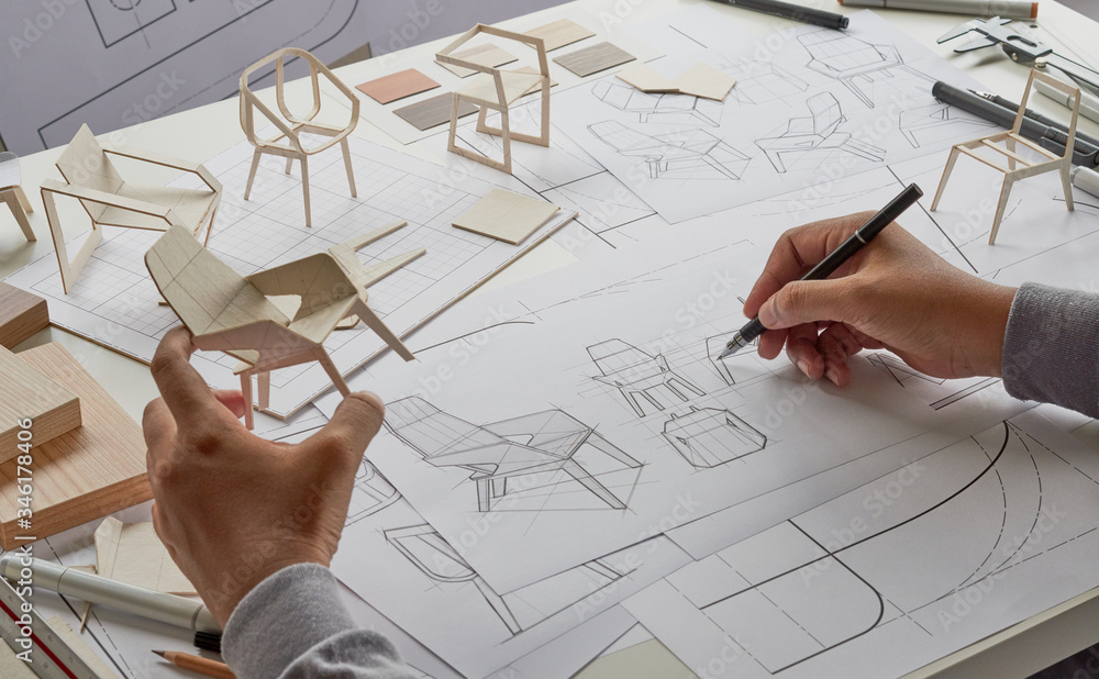 Designer sketching drawing design development product plan draft chair armchair Wingback Interior furniture prototype manufacturing production. designer studio concept . Designer sketching drawing design development product plan draft chair armchair Wingback Interior furniture prototype manufacturing production. designer studio concept .