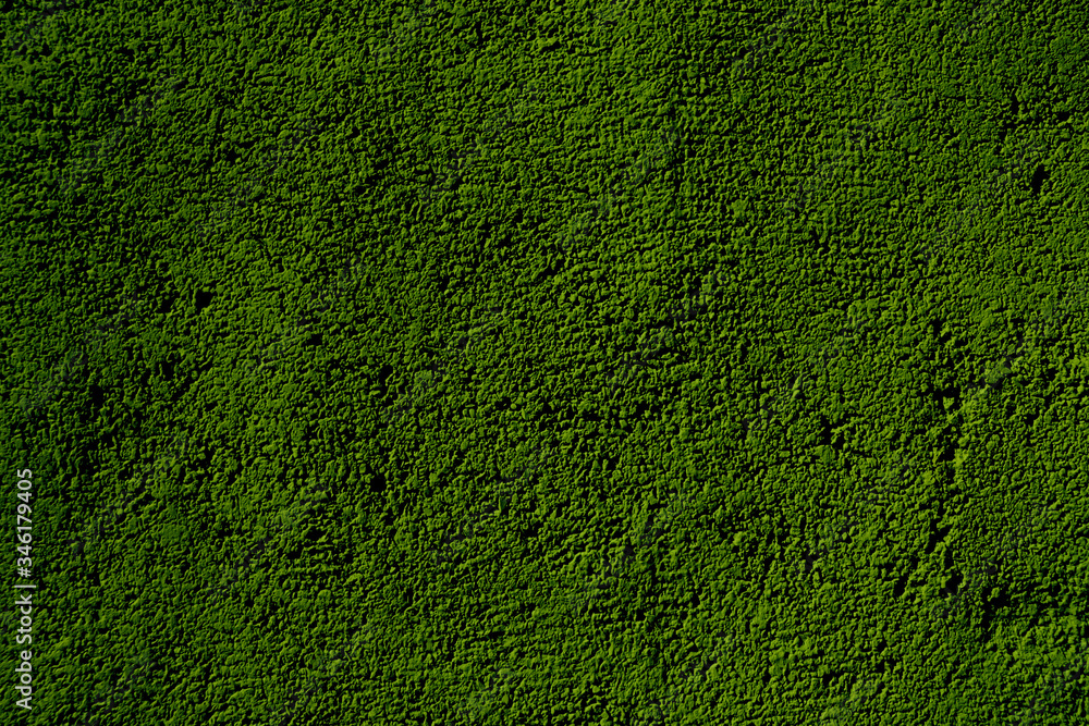 Green grainy background. Granular green surface. Green background Green grainy background. Granular green surface. Green background