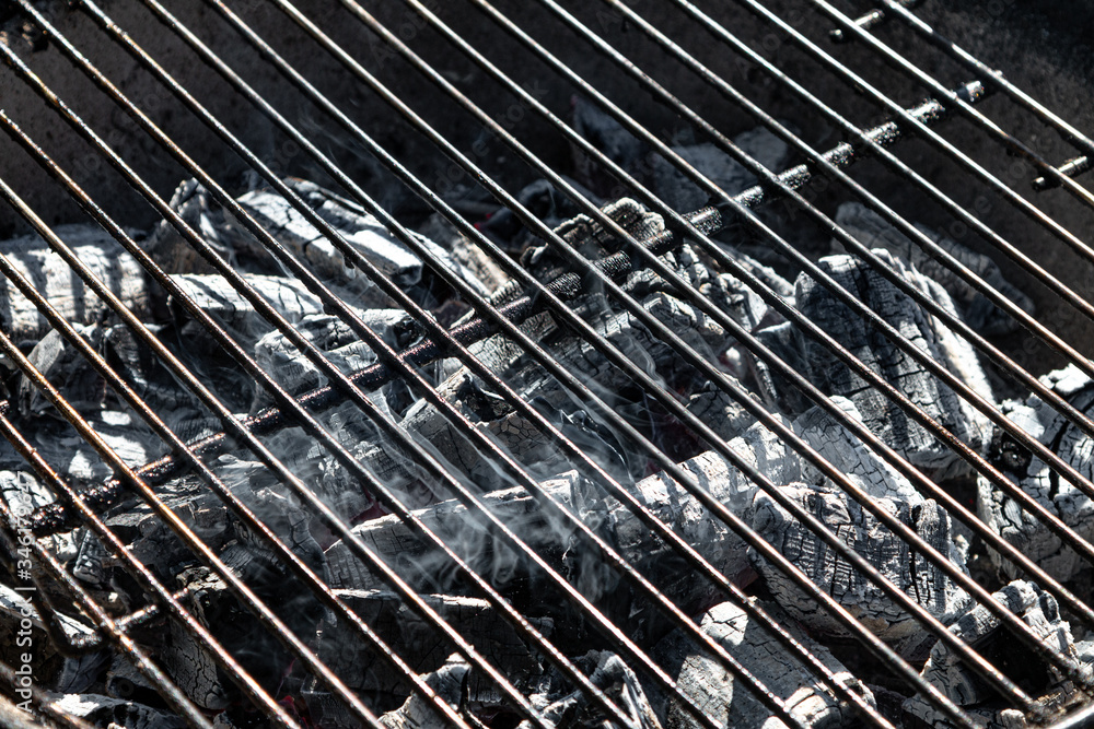 BBQ grill with burning coals close - up