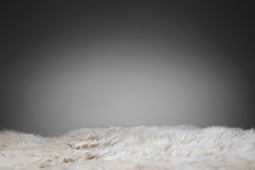 beige sheepskin texture on gray background